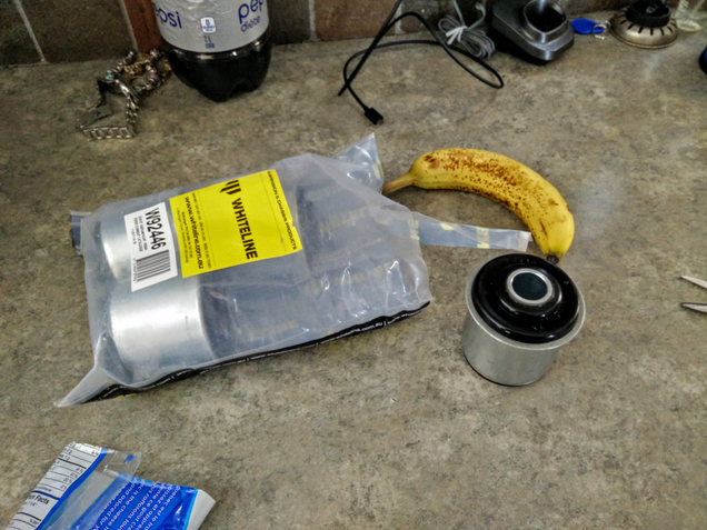 Subframe bushings: banana for scale.